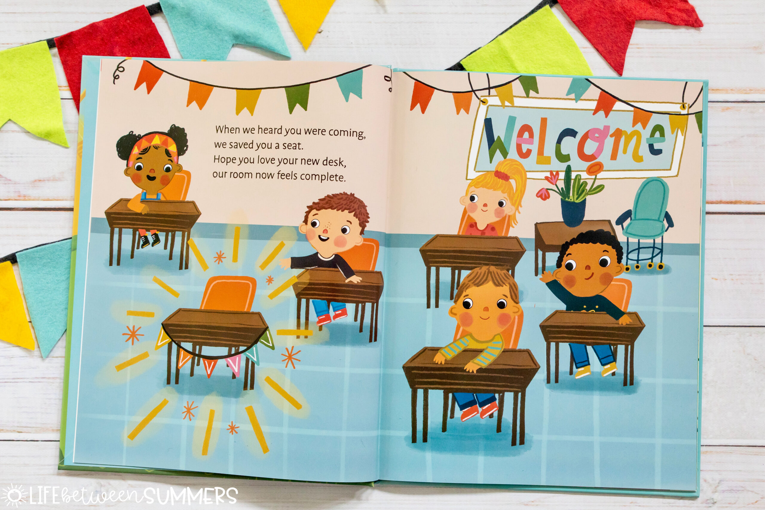 We're So Happy You're Here: A Warm Welcome for our New Student book illustration. Class showing the new student desk