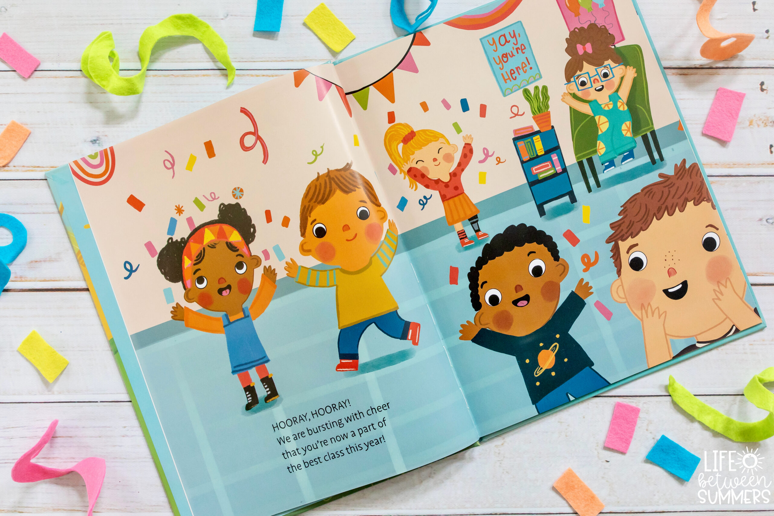 We're So Happy You're Here: A Warm Welcome for our New Student book illustration. Students celebrating