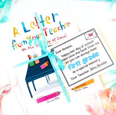 A book titled A Letter from Your Teacher on the First Day of School is tied with a blue ribbon and a card that reads, Dear Melanie: Happy 1st day of school! Please save this book from me as a special memory. Mrs. Matillin.