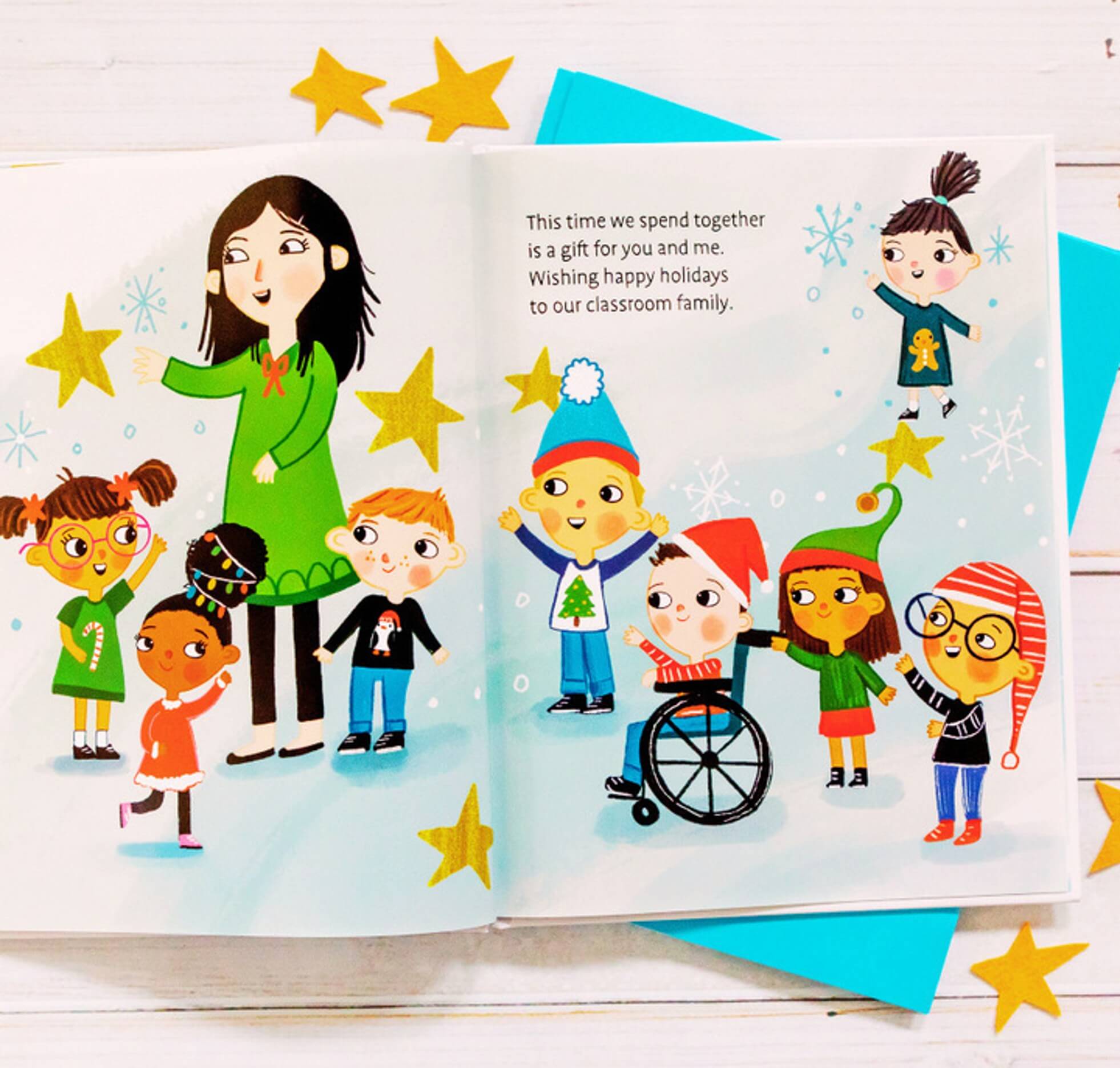 Illustrated children with diverse appearances and winter clothing stand with a smiling adult. One child uses a wheelchair. Gold stars are scattered around. Text on the page reads a holiday message about celebrating together.